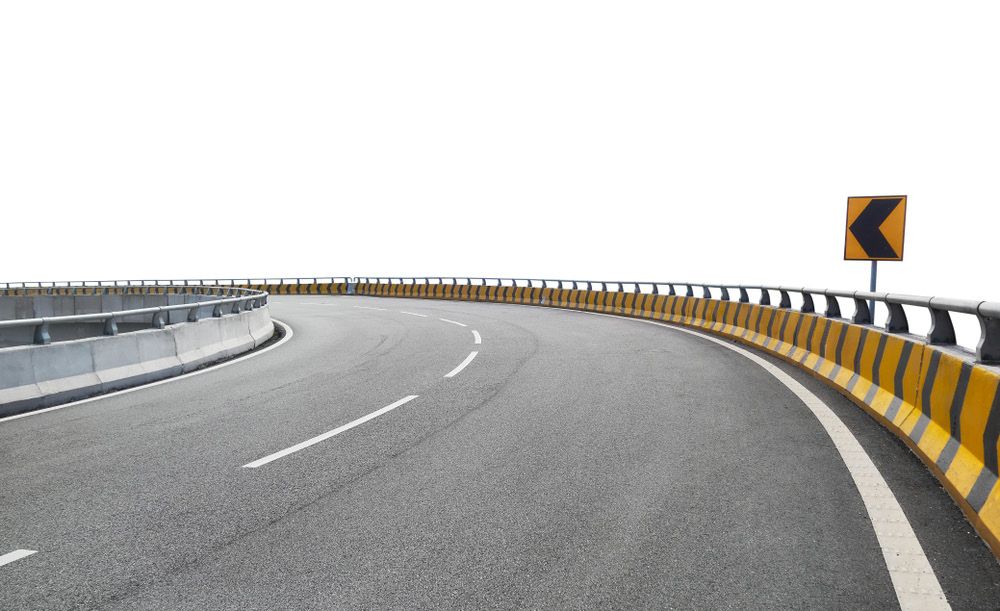 Highway curve with crash barrier